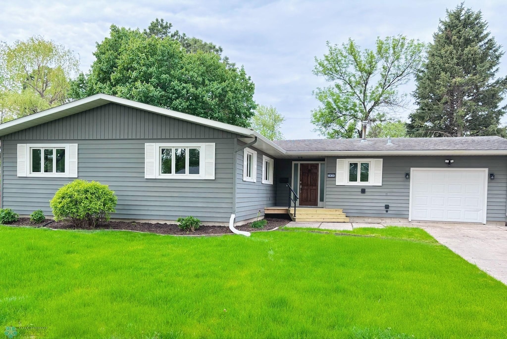 2834 2nd St N, Fargo, ND 58102 - single story home featuring an attached garage, a front lawn, and driveway