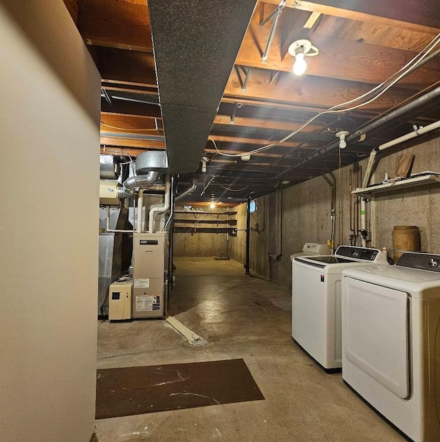 701 10th St NE, Austin, MN 55912 - unfinished basement with washer and dryer and heating unit
