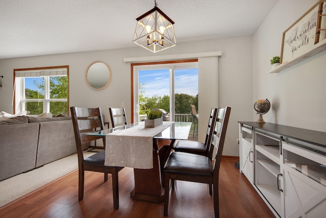 5133 Farnham Dr N, Hugo, MN 55038 - dining space featuring a chandelier and dark wood-type flooring
