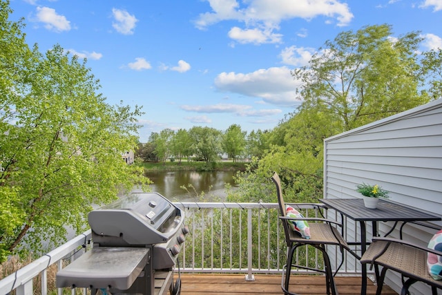 5133 Farnham Dr N, Hugo, MN 55038 - wooden deck featuring a water view, area for grilling, and outdoor dining space