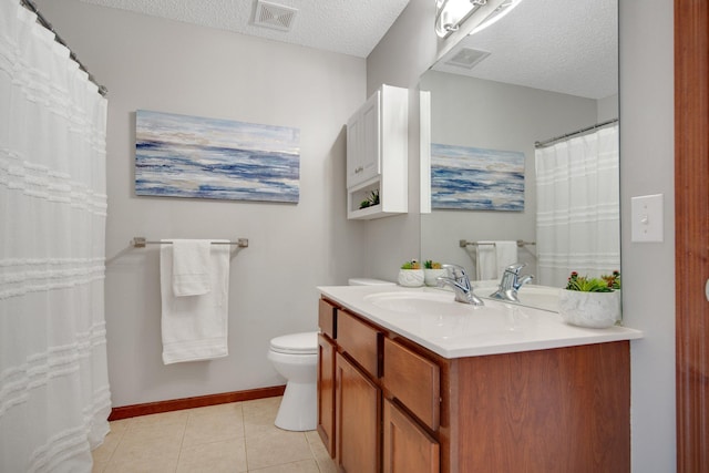 5133 Farnham Dr N, Hugo, MN 55038 - full bath featuring toilet, vanity, tile patterned flooring, a textured ceiling, and baseboards