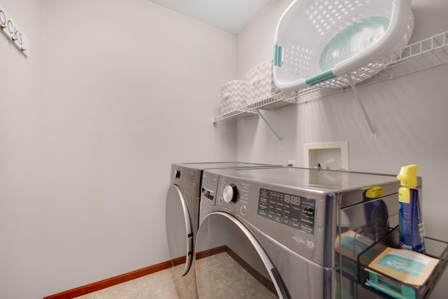 5133 Farnham Dr N, Hugo, MN 55038 - laundry room featuring independent washer and dryer, baseboards, and tile patterned flooring