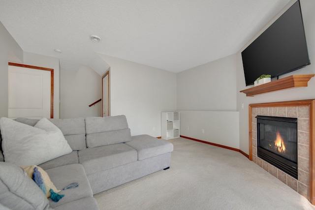 5133 Farnham Dr N, Hugo, MN 55038 - carpeted living room featuring a tiled fireplace and baseboards