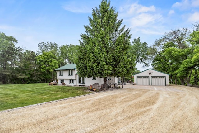 2511 Carver Ave E, Maplewood, MN 55119 - view of front of house featuring a garage, an outdoor structure, driveway, and a front lawn