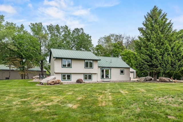 2511 Carver Ave E, Maplewood, MN 55119 - rear view of property with a lawn and metal roof
