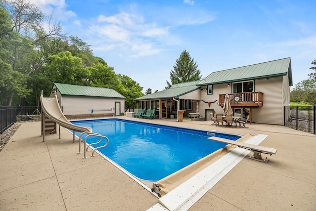 2511 Carver Ave E, Maplewood, MN 55119 - view of pool with a water slide, a patio, and a diving board
