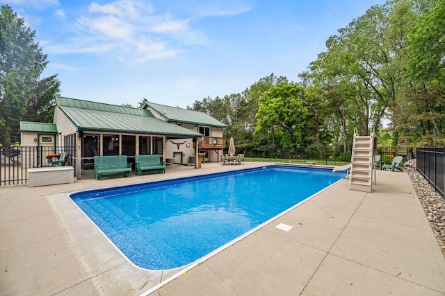 2511 Carver Ave E, Maplewood, MN 55119 - view of pool featuring a sunroom, a patio, and a diving board