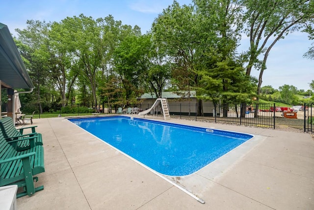 2511 Carver Ave E, Maplewood, MN 55119 - view of swimming pool with a water slide and a patio