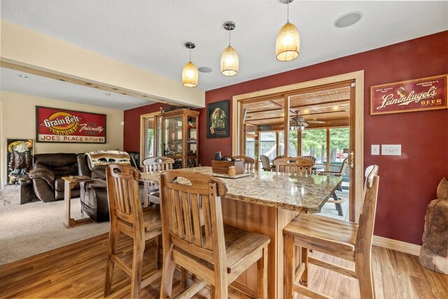 2511 Carver Ave E, Maplewood, MN 55119 - dining room with light wood-style flooring and baseboards