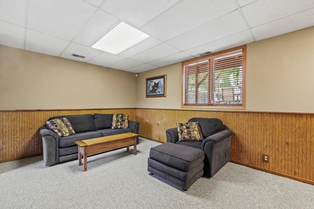 2511 Carver Ave E, Maplewood, MN 55119 - carpeted living area with a paneled ceiling, a wainscoted wall, and wood walls