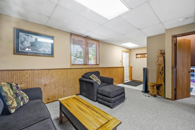 2511 Carver Ave E, Maplewood, MN 55119 - carpeted living area with a paneled ceiling, wainscoting, and wooden walls
