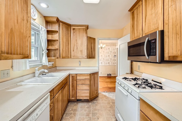7029 Augsburg Ave S, Richfield, MN 55423 - kitchen with white appliances, a sink, light countertops, open shelves, and brown cabinetry