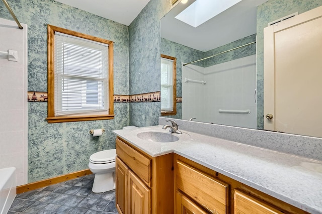 7029 Augsburg Ave S, Richfield, MN 55423 - bathroom featuring baseboards, toilet, vanity, wallpapered walls, and a skylight