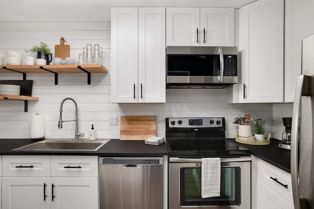 4119 Sylvia Ln S, Shoreview, MN 55126 - kitchen featuring stainless steel appliances, open shelves, a sink, white cabinetry, and dark countertops