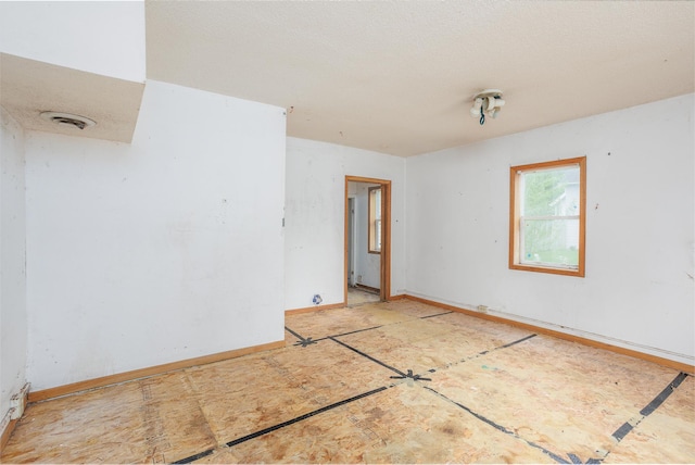 205 Elm Ave SE, Montgomery, MN 56069 - unfurnished room featuring baseboards