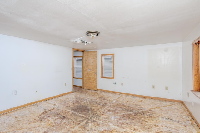 205 Elm Ave SE, Montgomery, MN 56069 - unfurnished room featuring baseboards