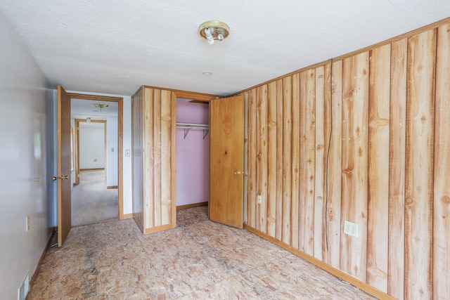 205 Elm Ave SE, Montgomery, MN 56069 - unfurnished bedroom with a closet and baseboards