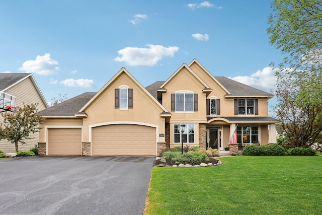 11560 Ashley Ct, Inver Grove Heights, MN 55077 - view of front of house with stucco siding, driveway, a front yard, stone siding, and an attached garage