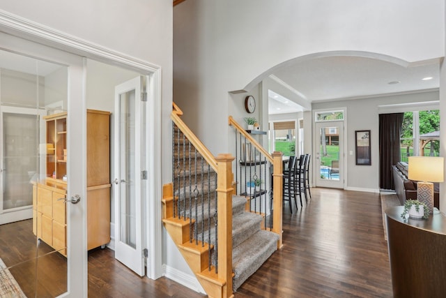 11560 Ashley Ct, Inver Grove Heights, MN 55077 - stairs featuring arched walkways, wood finished floors, baseboards, and french doors