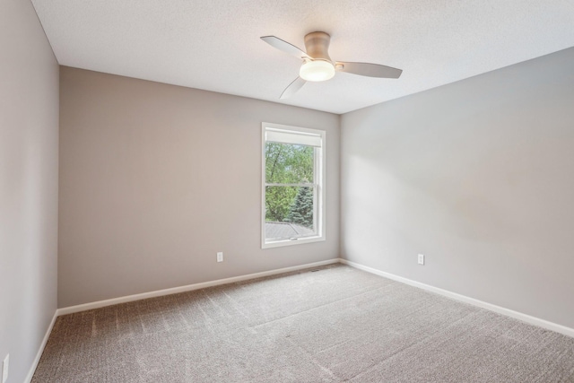 11560 Ashley Ct, Inver Grove Heights, MN 55077 - unfurnished room with carpet floors, a ceiling fan, and baseboards