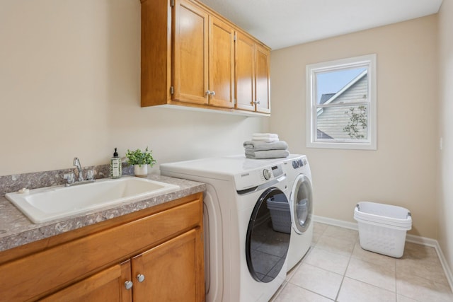 11560 Ashley Ct, Inver Grove Heights, MN 55077 - laundry area with washer and clothes dryer, cabinet space, baseboards, and light tile patterned floors