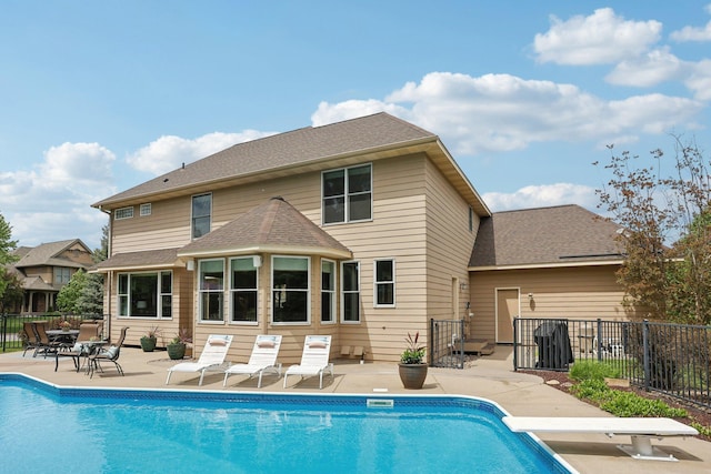 11560 Ashley Ct, Inver Grove Heights, MN 55077 - view of swimming pool with a patio area and a diving board
