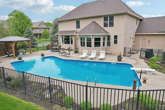 11560 Ashley Ct, Inver Grove Heights, MN 55077 - view of swimming pool with a gazebo, a fenced backyard, a patio area, and a diving board