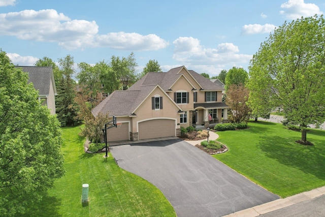 11560 Ashley Ct, Inver Grove Heights, MN 55077 - view of front of property with stucco siding, stone siding, driveway, and a front lawn