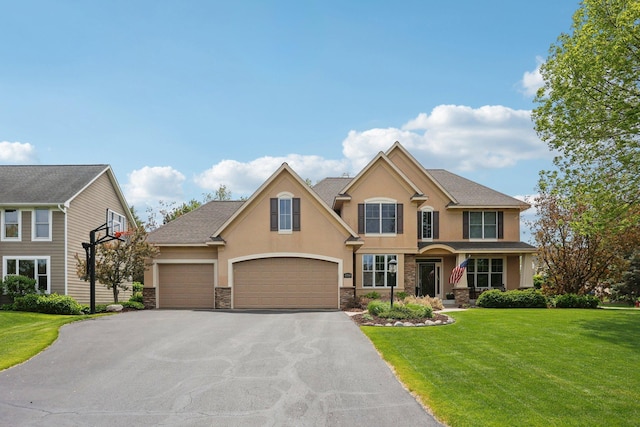 11560 Ashley Ct, Inver Grove Heights, MN 55077 - view of front of property with stucco siding, driveway, a front lawn, and stone siding