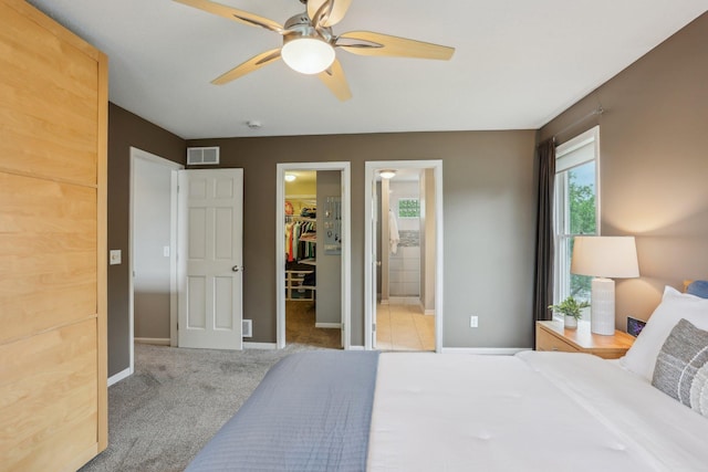11560 Ashley Ct, Eagan, MN 55077 - bedroom with a spacious closet, a closet, carpet, and baseboards