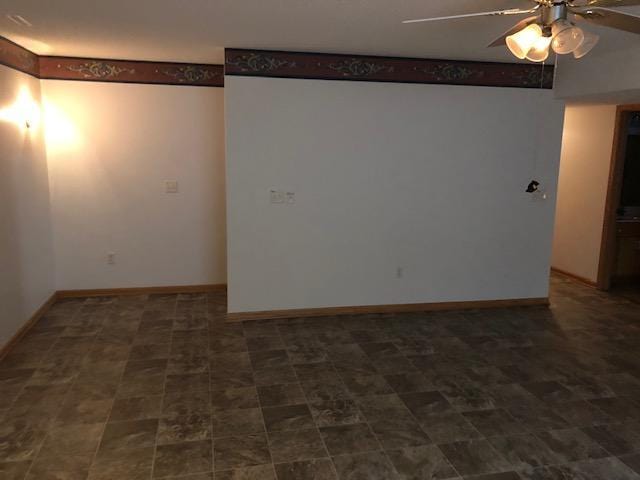 2023 Woodcrest Ln SW, Rochester, MN 55902 - empty room with a ceiling fan and baseboards