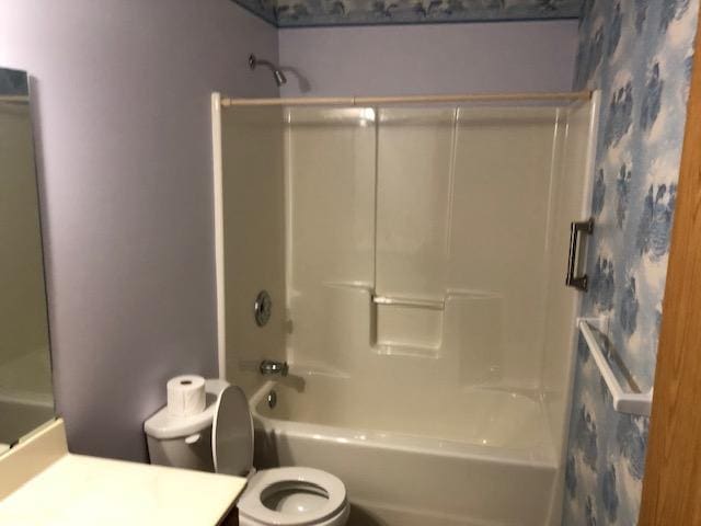 2023 Woodcrest Ln SW, Rochester, MN 55902 - bathroom featuring toilet, vanity, and  shower combination