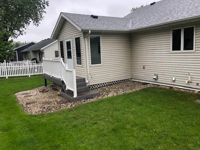 2023 Woodcrest Ln SW, Rochester, MN 55902 - view of side of home featuring a deck and a shingled roof