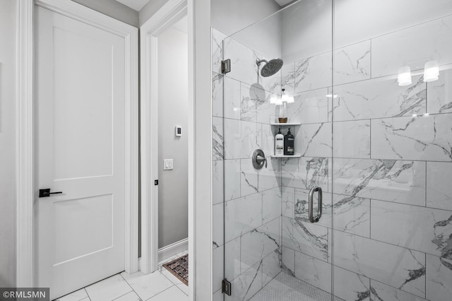 7023 61st St S, Cottage Grove, MN 55016 - full bathroom featuring a shower stall, marble look tile flooring, and baseboards