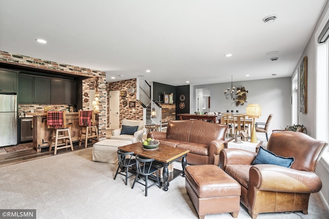 7023 61st St S, Cottage Grove, MN 55016 - carpeted living area featuring stairway, recessed lighting, and a chandelier