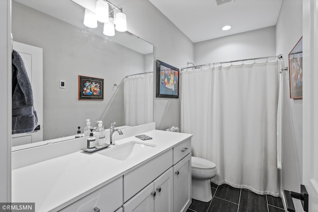 7023 61st St S, Cottage Grove, MN 55016 - full bathroom with toilet, vanity, shower / tub combo, and recessed lighting