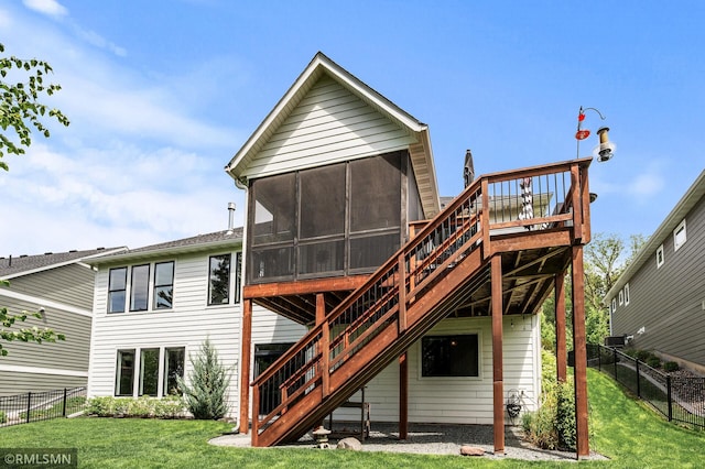 7023 61st St S, Cottage Grove, MN 55016 - rear view of house with stairs, a sunroom, and a deck