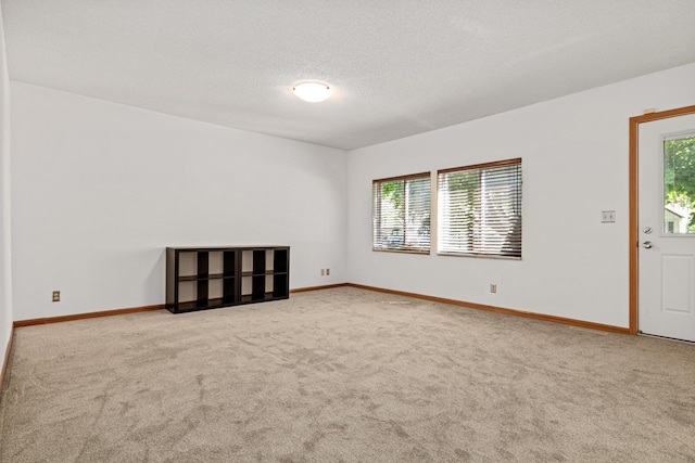 3372 Texas Ave S, Saint Louis Park, MN 55426 - spare room with carpet flooring, baseboards, and a textured ceiling