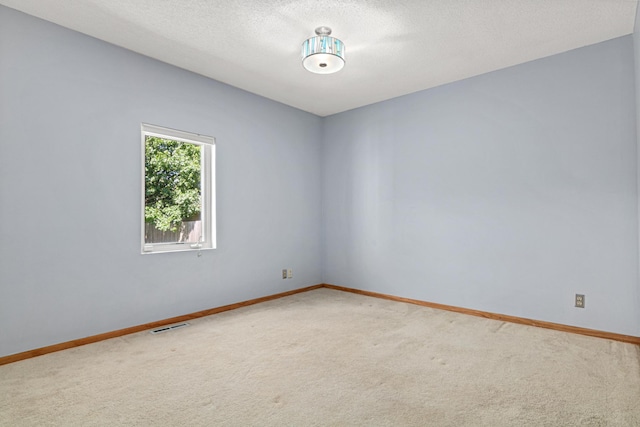 3372 Texas Ave S, Saint Louis Park, MN 55426 - unfurnished room featuring carpet flooring, baseboards, and a textured ceiling