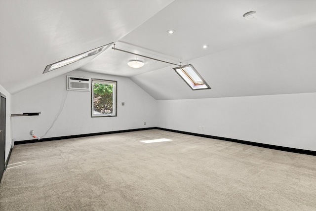 3372 Texas Ave S, Saint Louis Park, MN 55426 - additional living space with an AC wall unit, lofted ceiling, carpet, baseboards, and a skylight