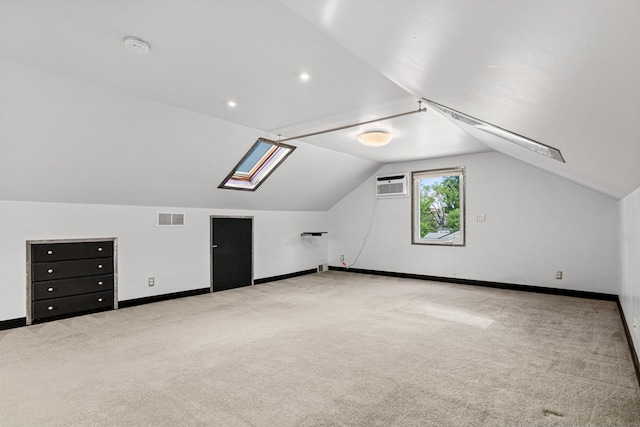 3372 Texas Ave S, Saint Louis Park, MN 55426 - bonus room featuring carpet, an AC wall unit, lofted ceiling, and baseboards