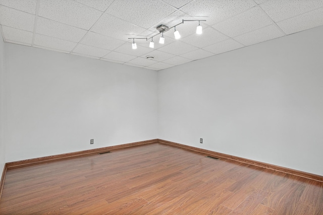 3372 Texas Ave S, Saint Louis Park, MN 55426 - unfurnished room featuring wood finished floors, baseboards, and a drop ceiling