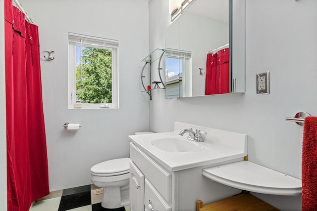 3372 Texas Ave S, Saint Louis Park, MN 55426 - full bathroom featuring toilet, vanity, and a shower with shower curtain