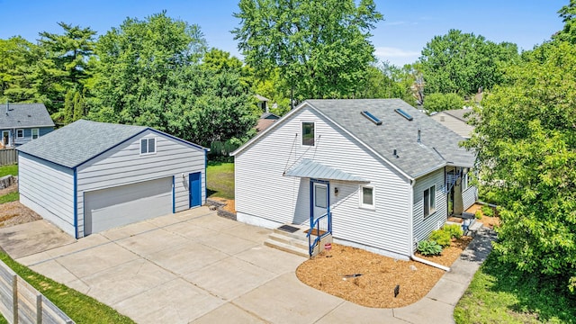 3372 Texas Ave S, Saint Louis Park, MN 55426 - view of front of house with an outdoor structure, a detached garage, a shingled roof, and view of scattered trees