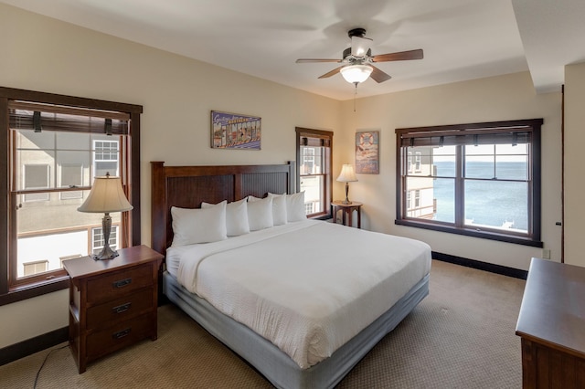502 Cleveland Blvd W Unit 2400, Walker, MN 56484 - bedroom with light colored carpet, baseboards, and a ceiling fan