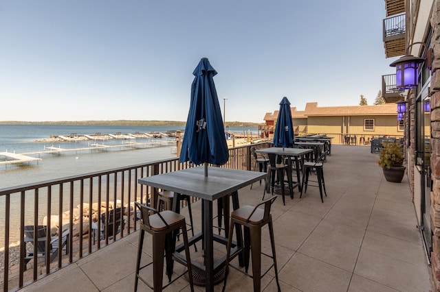 502 Cleveland Blvd W Unit 2400, Walker, MN 56484 - view of patio / terrace with outdoor dining area, a water view, and a balcony