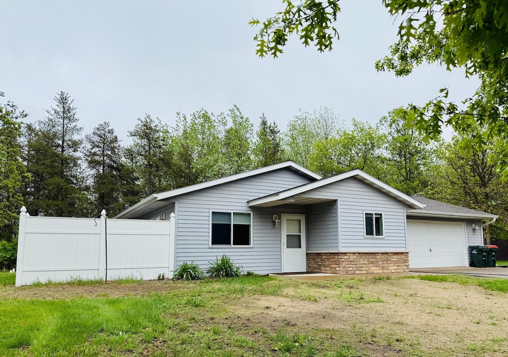 12658 Chestnut Dr, Baxter, MN 56425 - view of front facade featuring an attached garage and driveway