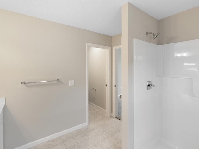 3228 Kady Ave NE, Saint Michael, MN 55376 - bathroom featuring a shower, tile patterned floors, and baseboards