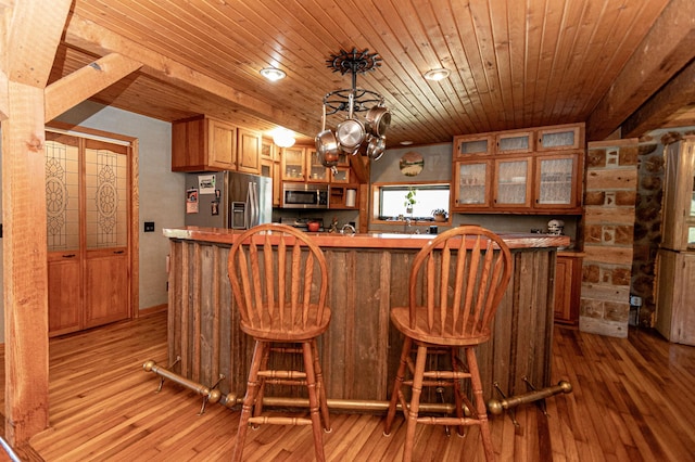 12926 Daisy Ln SW, Farwell, MN 56327 - kitchen with stainless steel appliances, brown cabinets, light wood-style flooring, a chandelier, and wood ceiling
