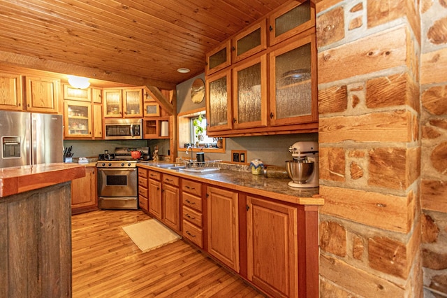 12926 Daisy Ln SW, Farwell, MN 56327 - kitchen with appliances with stainless steel finishes, light wood-type flooring, wooden ceiling, brown cabinets, and glass insert cabinets